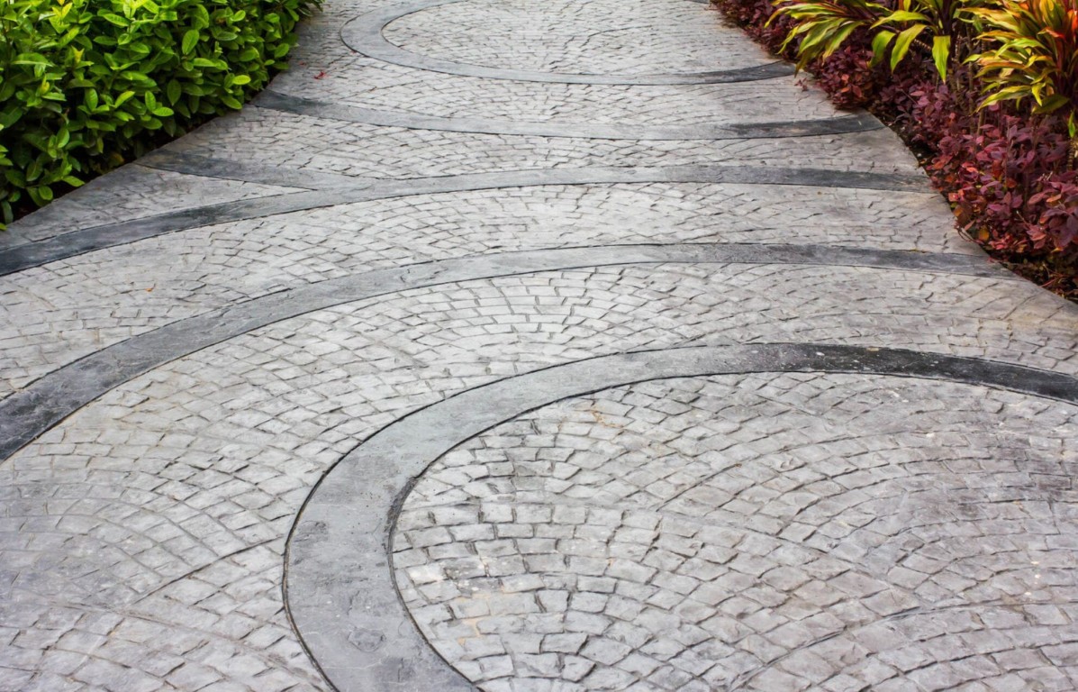 Stamped concrete walkway with circular pattern design